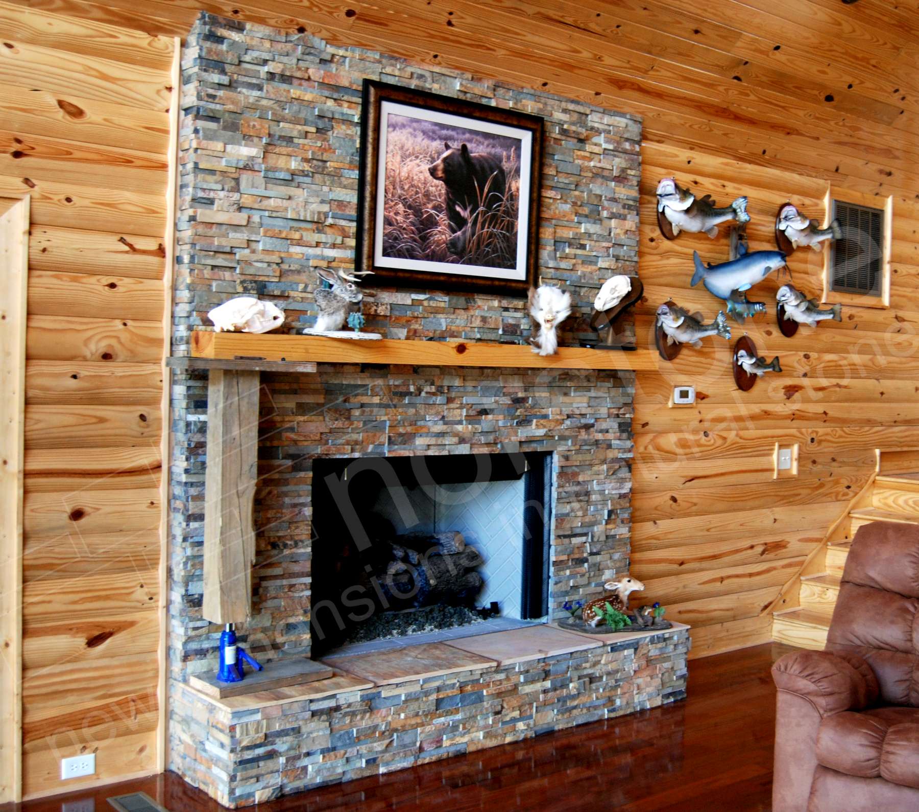 Norstone Ochre Rock Panels used on a fireplace with outside corners at a man cave hunting lodge